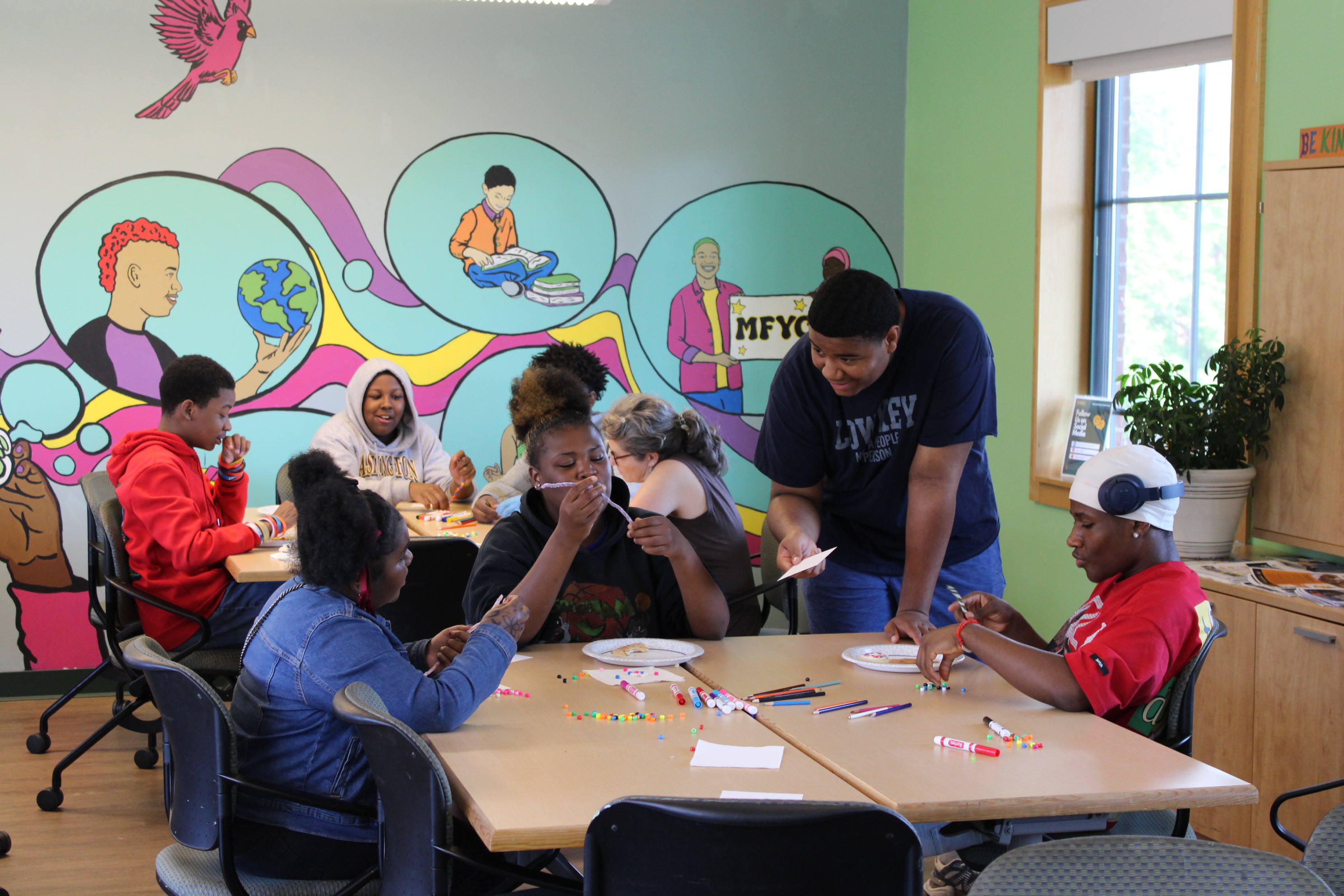 Youth doing activities at a table
